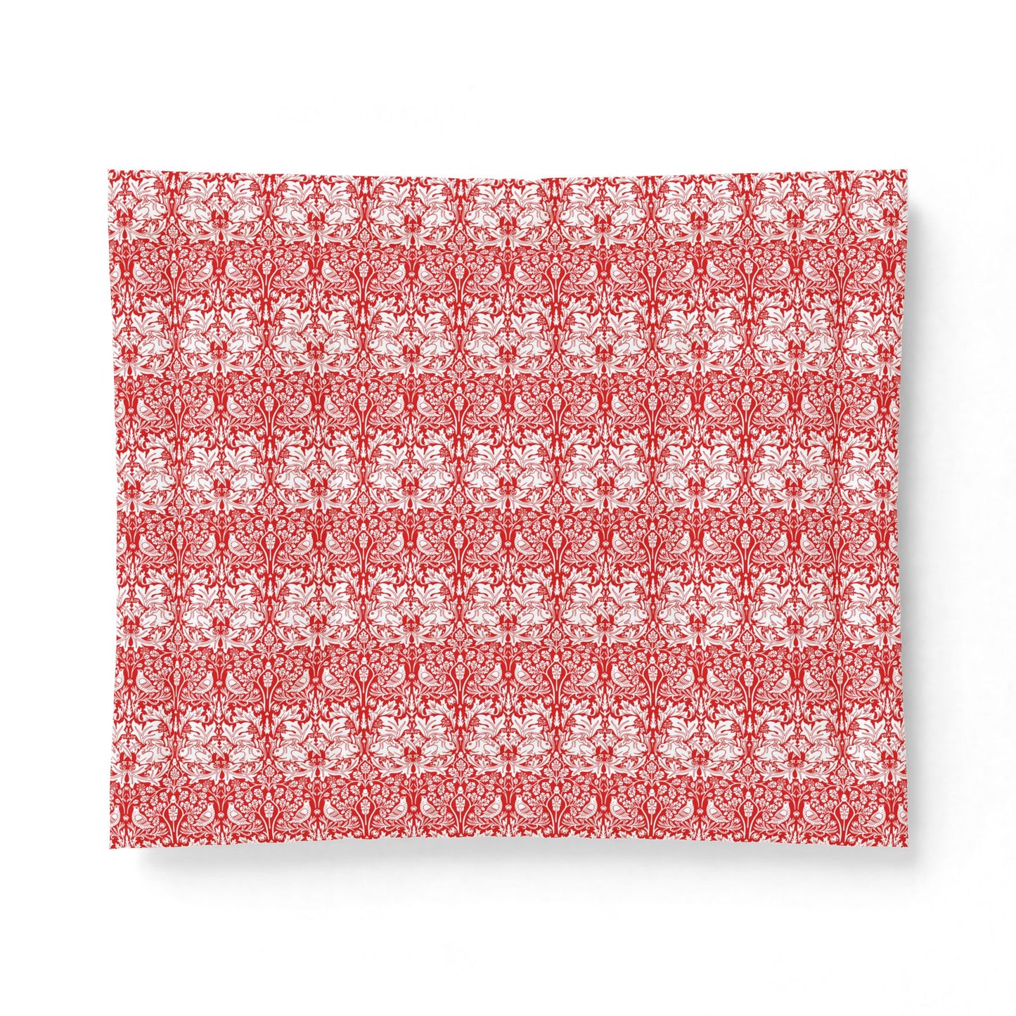 Red and white patterned fabric on a white background