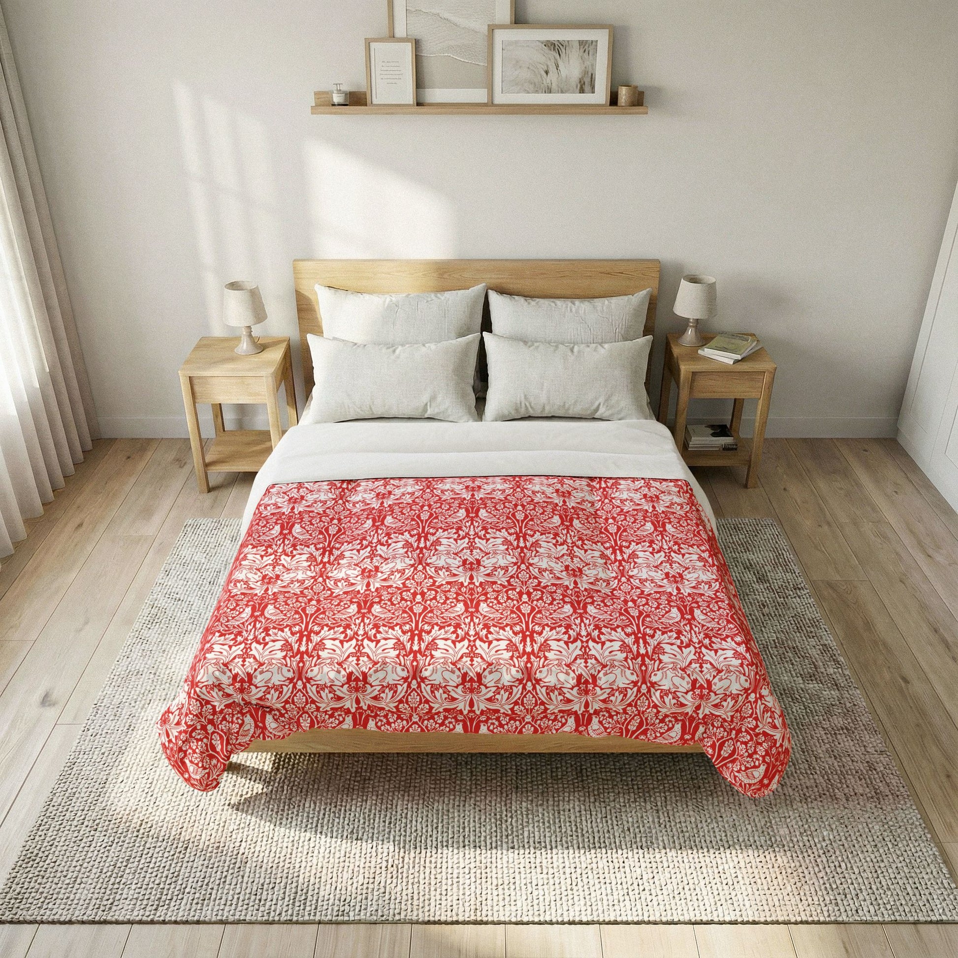 Bed with red floral comforter in a bedroom setting