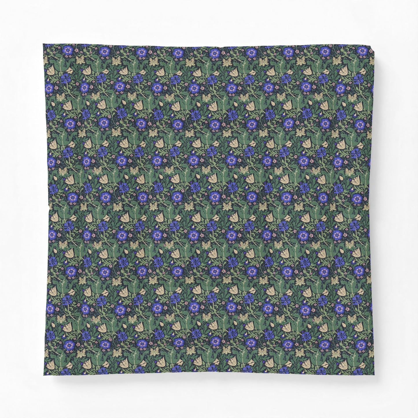 A square fabric item, likely a bandana or scarf, featuring a dense repeating pattern of blue flowers, green leaves, and small cream-colored rabbits on a dark green background.