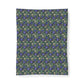 A rectangular fabric wall tapestry featuring a dense, repeating pattern of blue-purple flowers, green leaves, and small cream-colored rabbits, shown against a plain white background.