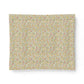 A square fabric or paper napkin featuring a dense, vintage-style floral and botanical pattern in muted yellow, pink, green, and beige tones, displayed flat against a clean white background.