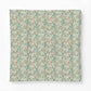 Cotton comforter from William Morris & Co featuring a dense vintage floral and botanical pattern in muted teal, sage green, dusty orange, and cream on a white background.