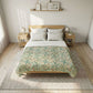 Bedroom with a bed featuring a patterned comforter and wooden headboard.