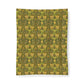 Patterned fabric with green and yellow design on a white background