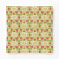 A square fabric item, likely a pillowcase or small blanket, featuring a vintage-style floral damask pattern in pink, green, yellow, and cream on a white background.