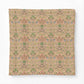 A square decorative pillow or cushion cover featuring a vintage-style botanical pattern in muted pink, sage green, and blue on a warm beige background, shown against a plain white studio backdrop.