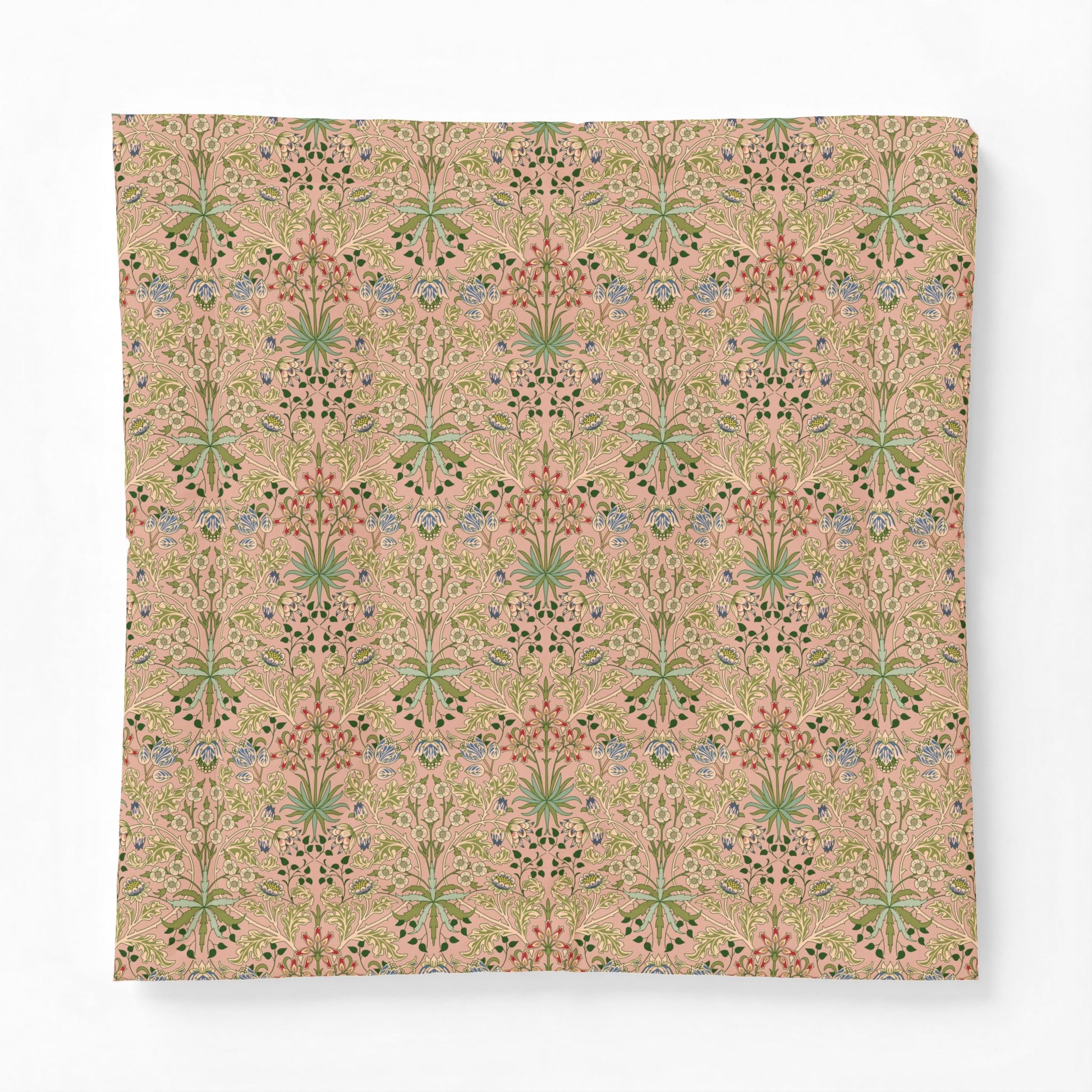 A square decorative pillow or cushion cover featuring a vintage-style botanical pattern in muted pink, sage green, and blue on a warm beige background, shown against a plain white studio backdrop.