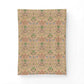 A rectangular fabric panel or pillow cover featuring a vintage botanical pattern in muted pink, green, and blue on a warm beige background, displayed against a clean white backdrop.