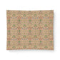 A square fabric or paper sample with an intricate repeating floral and botanical pattern on a warm beige background, featuring green, pink, and blue details, shown against a plain white background.