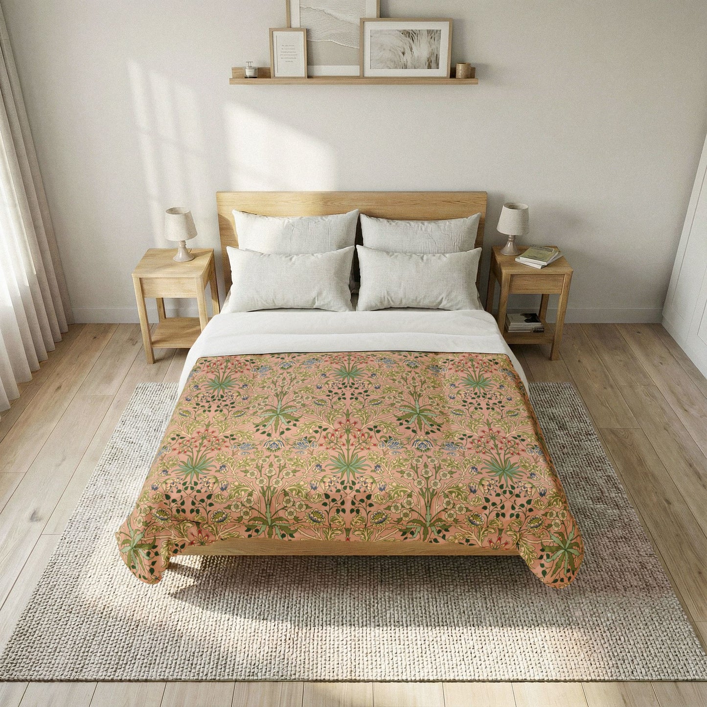 A neatly made bed in a bright bedroom, featuring a floral-patterned quilt in warm beige, pink, and green tones over white bedding and pillows, with a light wood headboard and matching side tables.