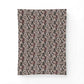 A rectangular fabric item, likely a pillowcase or small blanket, featuring an intricate vintage damask floral pattern in muted dusty pink, burgundy, and cream on a dark charcoal background, shown flat against a white backdrop.