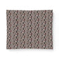 A rectangular fabric placemat featuring an intricate vintage damask floral pattern in muted tones of dusty pink, mauve, charcoal gray, and beige, shown against a plain white background.