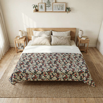 Bedroom with a bed featuring a patterned quilt and wooden headboard.