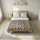 Bedroom with a wooden bed and floral comforter