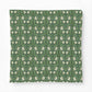 Patterned fabric with white floral design on a green background