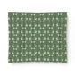 Patterned paper with green and white design on a white background