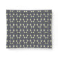 Patterned fabric swatch with small white flowers on a dark blue background