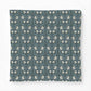 Patterned fabric with a blue and white design on a white background