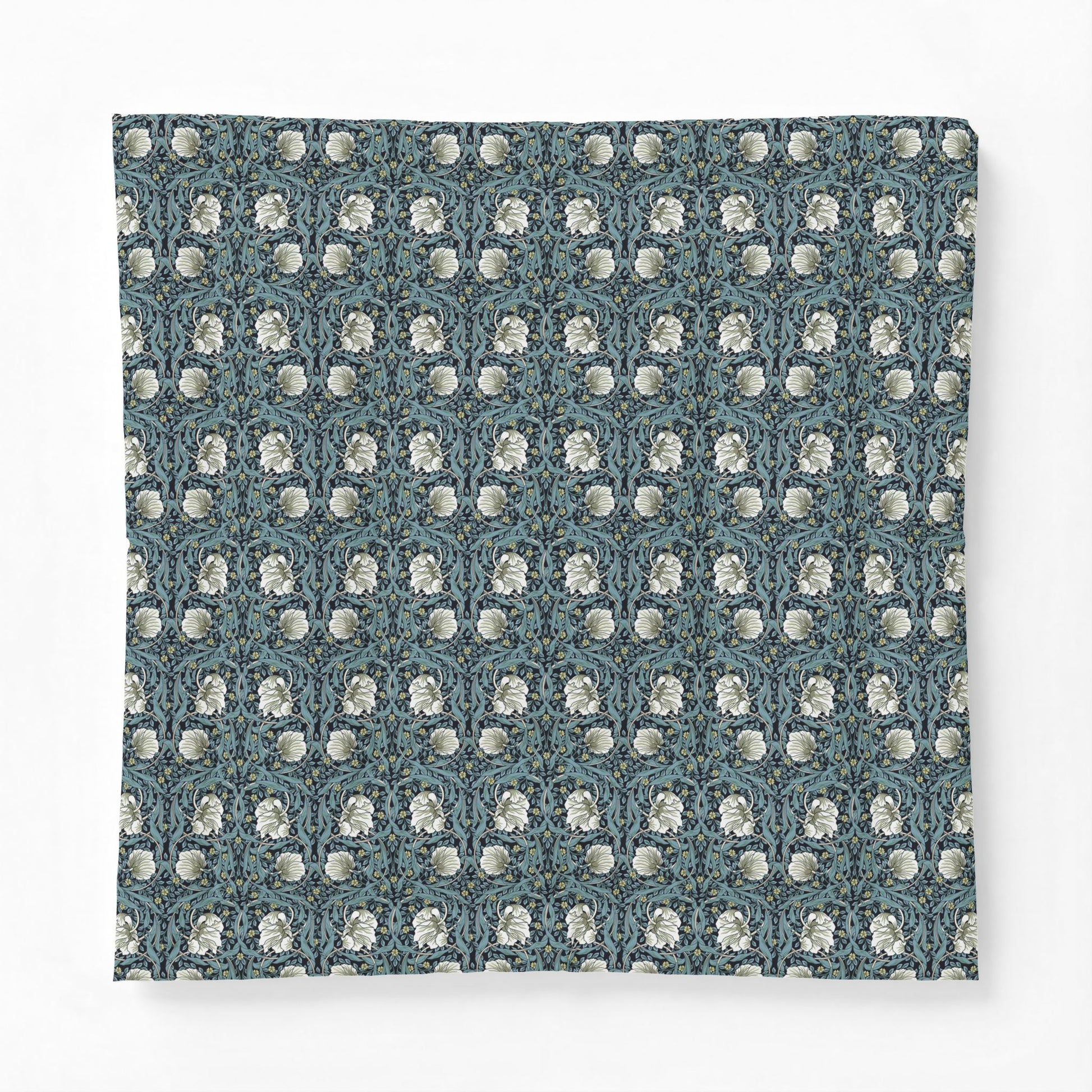 Patterned fabric with a blue and white design on a white background