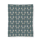 Patterned fabric swatch with floral design on a blue background