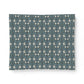 Patterned blue and white fabric swatch on a white background