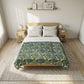 Bed with floral patterned comforter in a bedroom setting