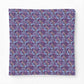 Patterned fabric with blue and pink design on a purple background
