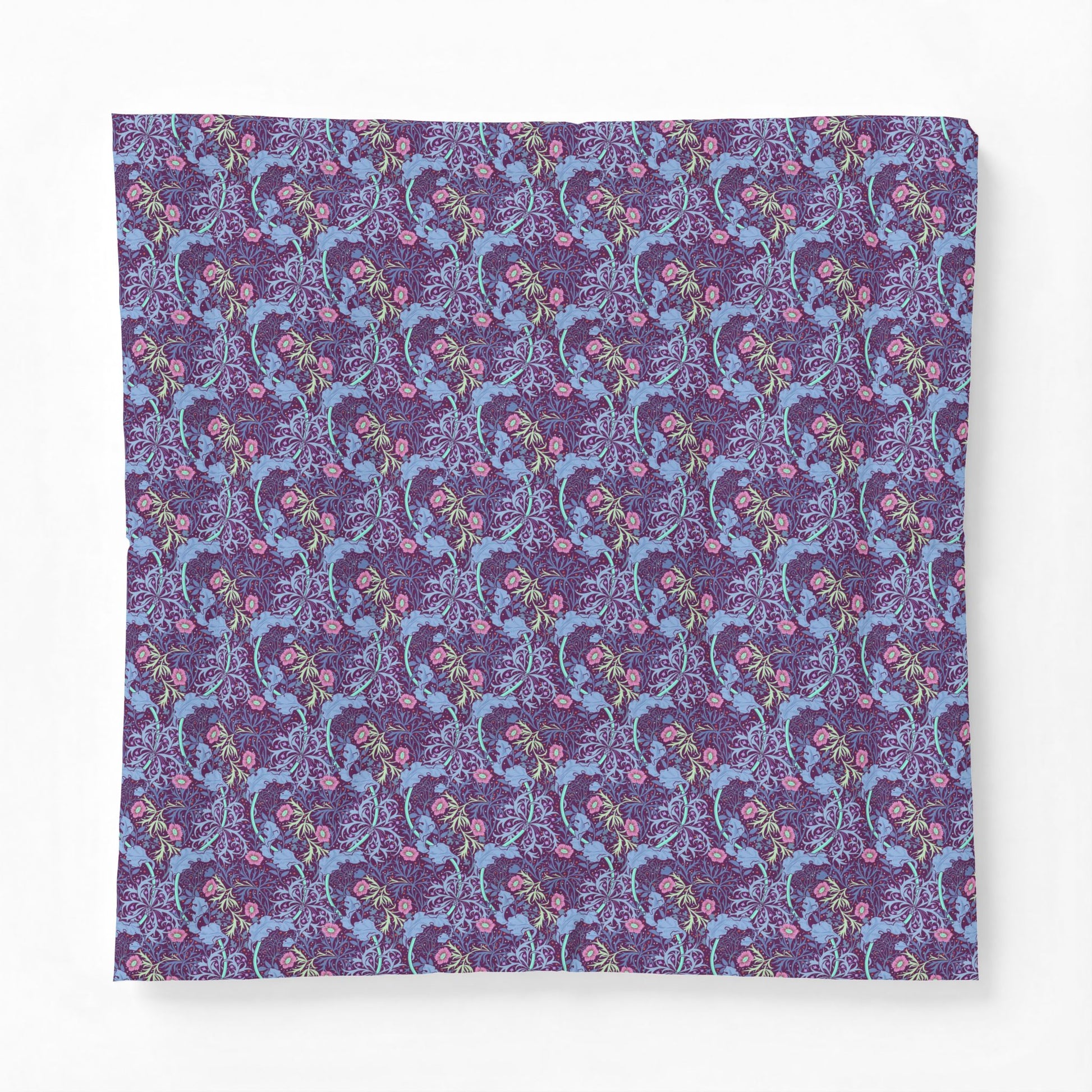 Patterned fabric with blue and pink design on a purple background