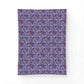 Patterned fabric swatch with blue and pink design on a purple background