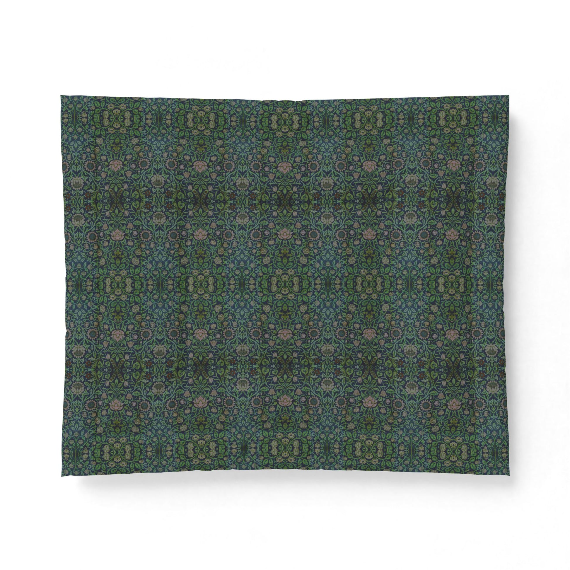 A square fabric or paper napkin featuring an intricate, symmetrical kaleidoscopic pattern in shades of teal, green, and muted pink, displayed flat against a clean white background.