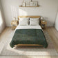 Bedroom with a bed featuring a green plaid comforter and white pillows.