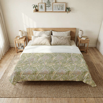 Bedroom with a bed featuring a green patterned duvet cover, wooden headboard, and side tables.