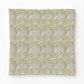 Patterned fabric swatch with a green and beige design on a white background