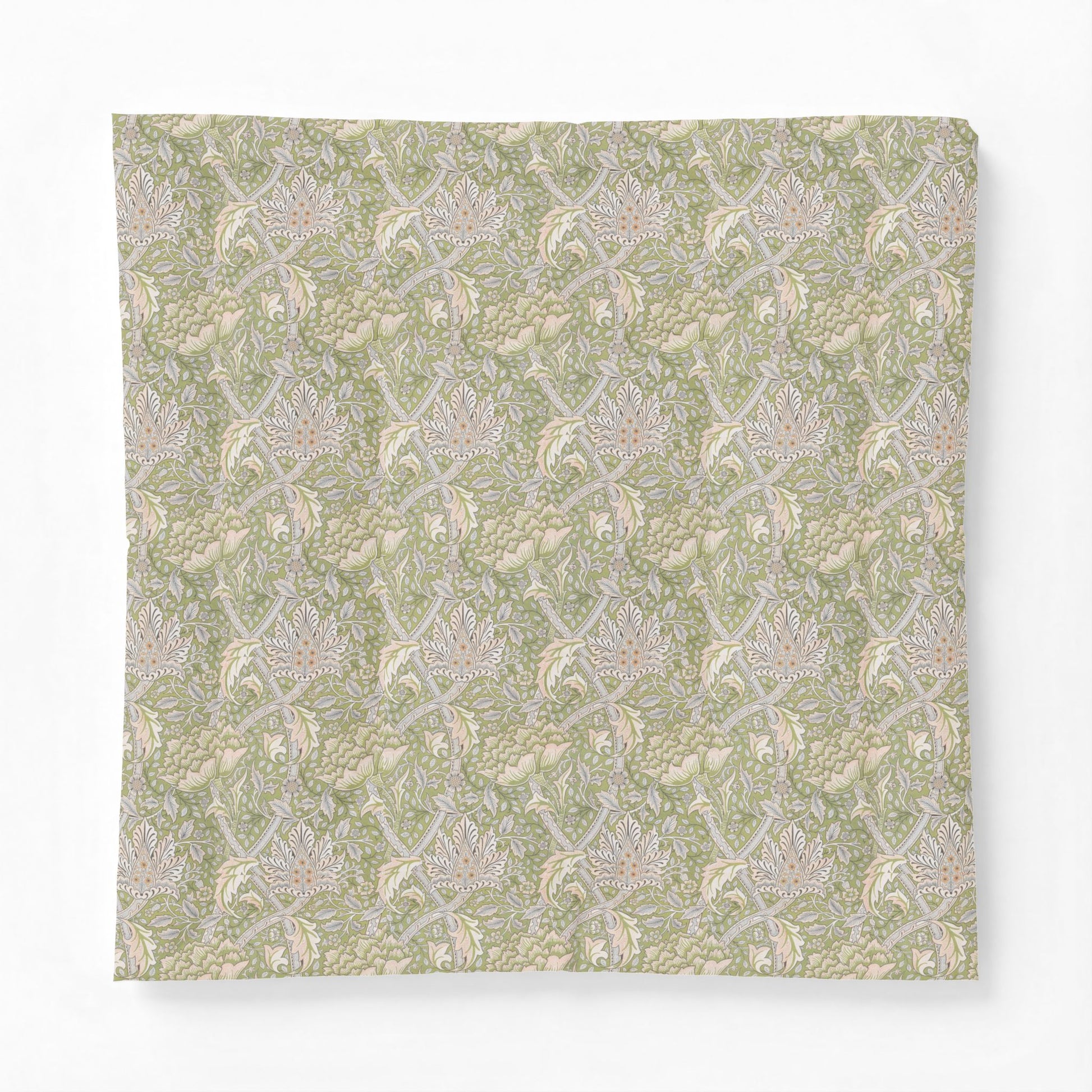 Patterned fabric swatch with a green and beige design on a white background