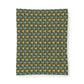 A rectangular fabric item, likely a blanket or tapestry, featuring a repeating William Morris-style floral pattern in yellow, green, and gray on a dark green background, shown against a plain white background.