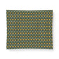 A rectangular fabric or paper sheet with a repeating pattern of small yellow flowers and green leaves on a dark green background, shown against a plain white backdrop.