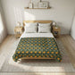 Bed with floral patterned comforter in a bedroom setting