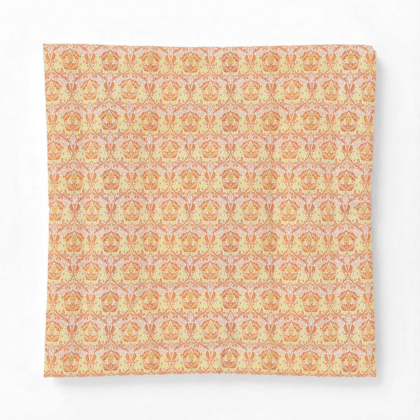 A square fabric cushion cover featuring a repeating ornate damask pattern in warm orange, yellow, and soft pink tones, shown against a plain white background.
