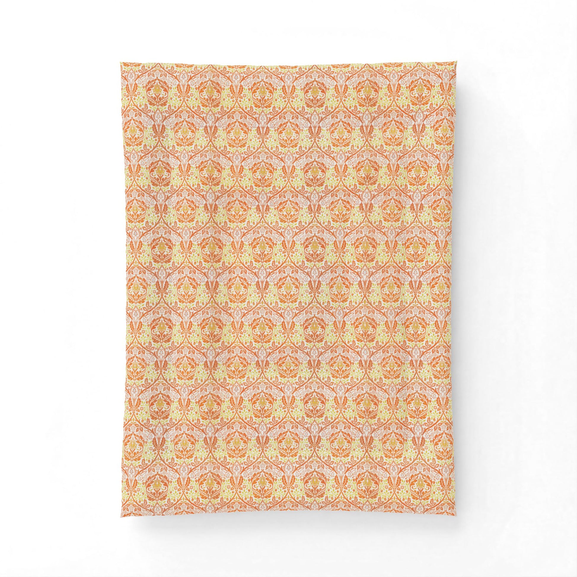 A rectangular fabric panel or throw featuring a repeating ornate damask-style pattern in warm peach, orange, cream, and pale pink tones, shown against a plain white background.