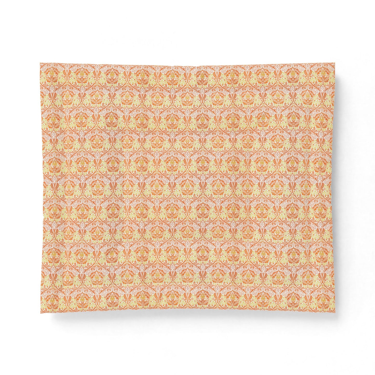 A rectangular fabric placemat with a repeating ornate damask pattern in soft peach, orange, and pale pink tones, shown on a clean white background.