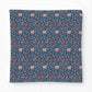 A square fabric item, likely a pillow cover or throw blanket, featuring a classic William Morris-style floral pattern in navy blue, cream, and red.