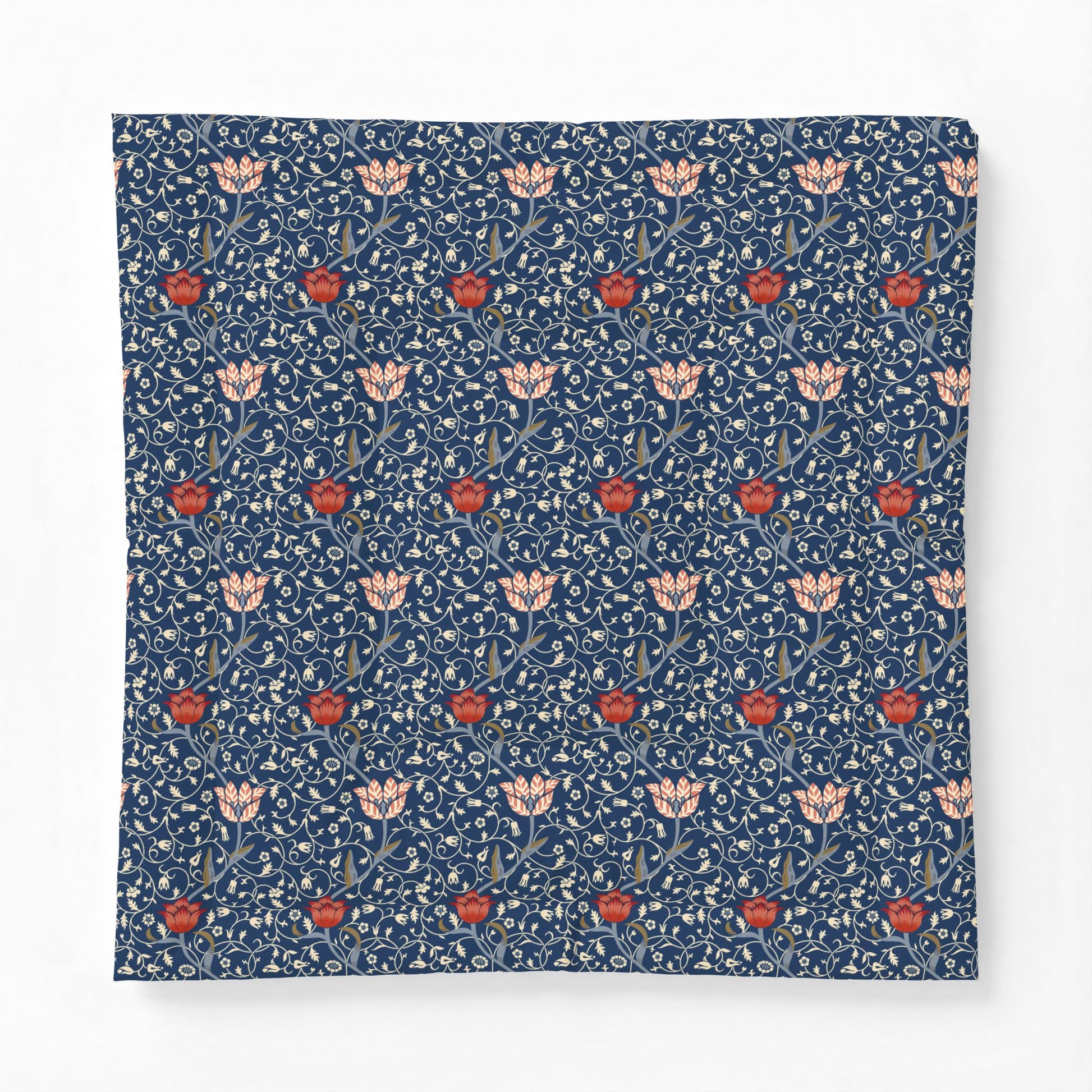 A square fabric item, likely a pillow cover or throw blanket, featuring a classic William Morris-style floral pattern in navy blue, cream, and red.