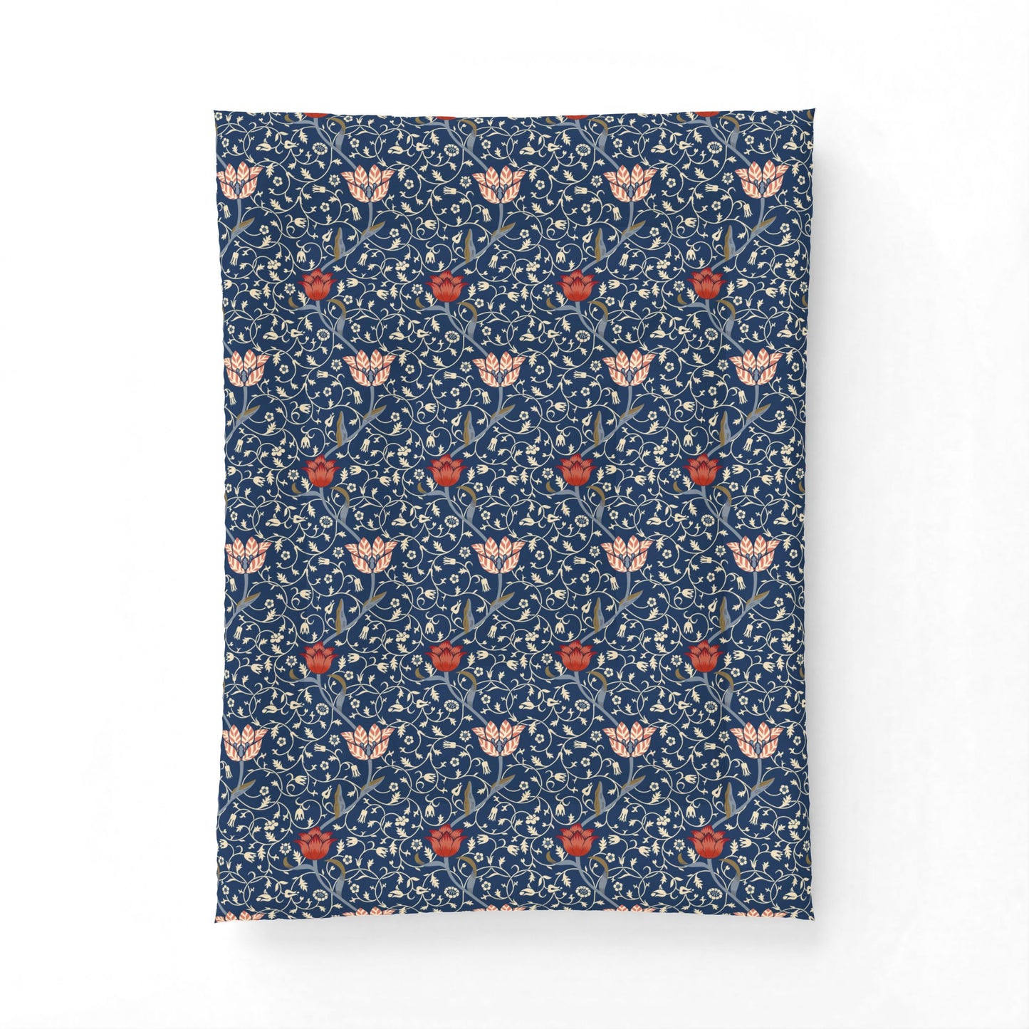 A rectangular textile item, likely a pillowcase or small blanket, featuring a dense William Morris-style floral pattern in navy blue, cream, and red on a plain white background.