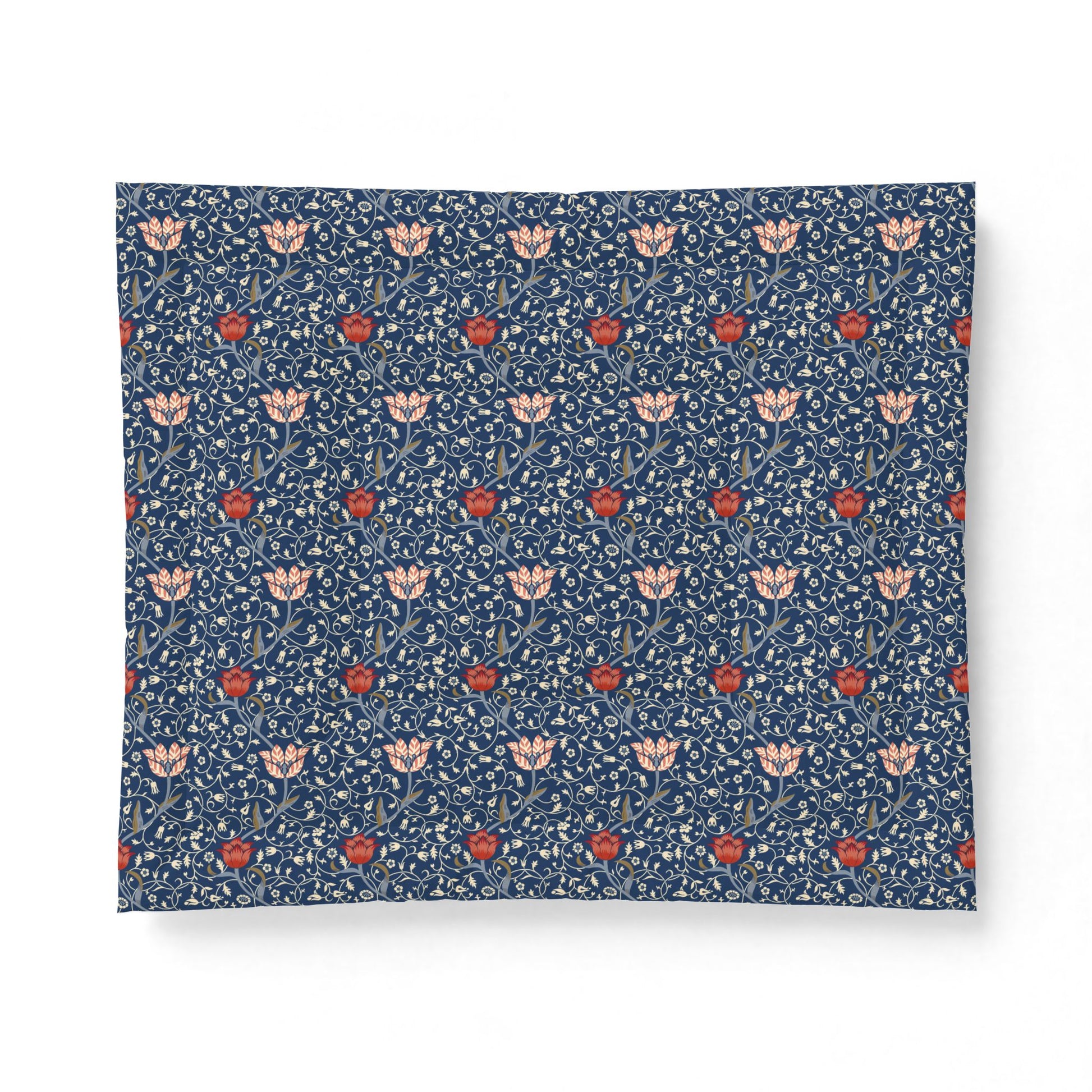 A square fabric or textile sample with a dense floral pattern on a dark blue background, featuring light pink flowers, red blossoms, and small white details. The textile is photographed flat against a clean white background.
