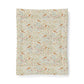 A rectangular fabric cotton comforter with an all-over William Morris-style floral and bird pattern, shown flat against a clean white background.