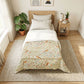 A neatly made single bed in a bright, minimalist bedroom. The bedding features a light cream base with a detailed botanical and bird pattern in muted green, terracotta, and soft blue tones.