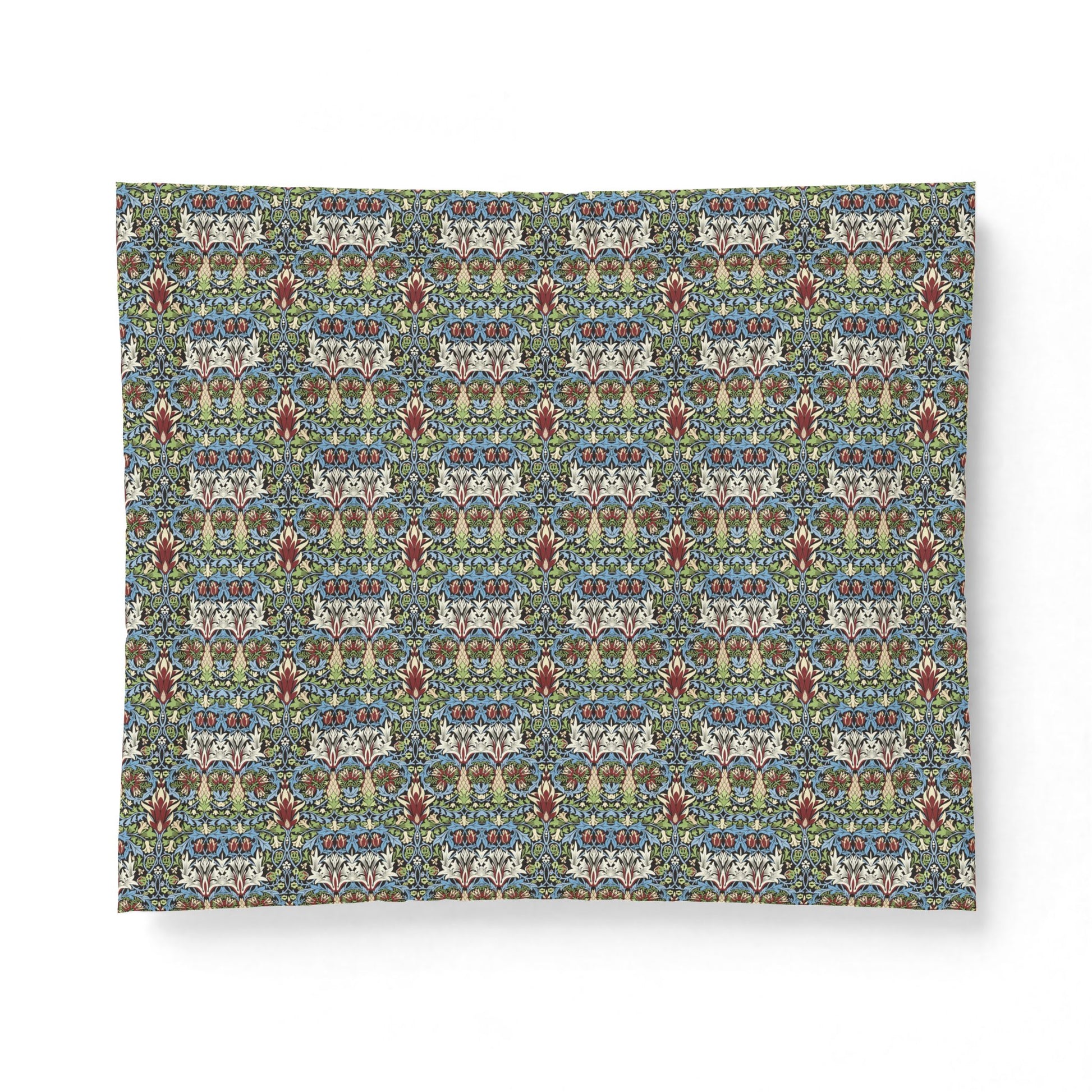 A square fabric or paper sheet with a dense, symmetrical floral and ornamental pattern in muted blue, green, beige, red, and white, shown against a plain white background.
