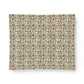 Patterned fabric swatch with geometric design on a white background
