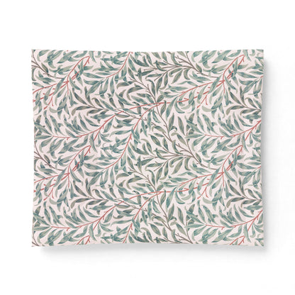 Floral patterned cotton comforter on a white background