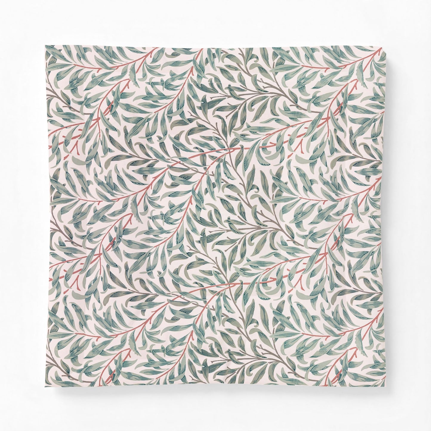 Patterned cotton comforter with green leaves and red stems on a white background